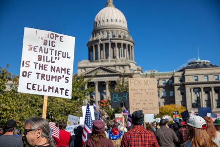 A crowd of people are protesting outside of the capitol buildingのeditorial素材