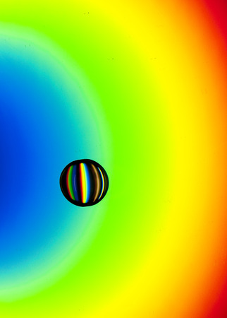 Water Drop on a CD Rainbowの写真素材