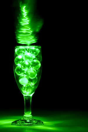 Wine Glass Illuminated with Green Light Paintingの写真素材