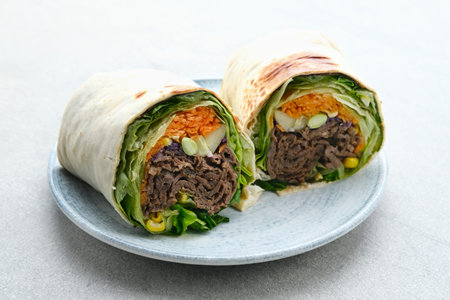 Salad Wrap. Tortilla wraps with beef teriyaki and fresh vegetables. Close up and selective focus image.の写真素材