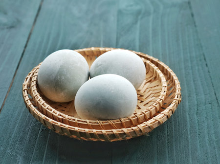 Salted egg. Homemade salted eggs made from duck eggs. Close up and copy space.の写真素材