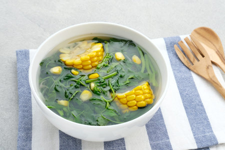 Sayur Bening Bayam, Spinach Clear Vegetable. Indonesian food of spinach, spinach soup with corn.