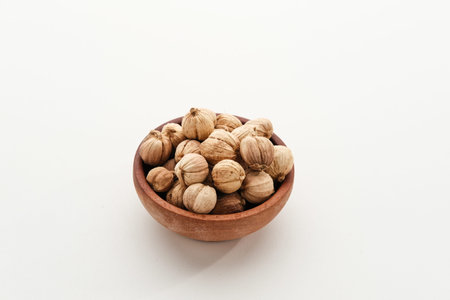 Best cardamom, Siam Cardamom or Kapulaga on white canvas background. Dried seeds, dried herb spice.の写真素材