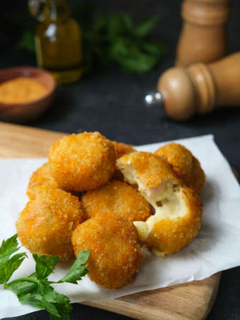 Delicious homemade bitterballen made from flour, cheese, milk coated with bread crumb filled with mozzarella.の写真素材
