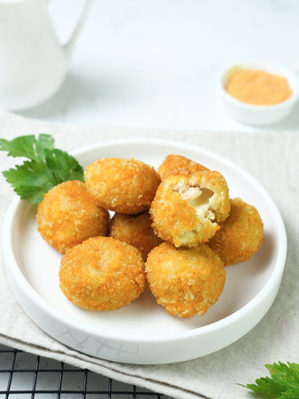 Delicious homemade bitterballen made from flour, cheese, milk coated with bread crumb filled with mozzarella.の写真素材