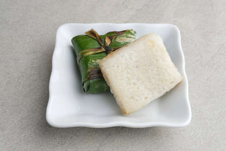 Lemper is an Indonesian savoury snack made of glutinous rice filled with seasoned shredded chicken atau  abon (meat floss).の写真素材