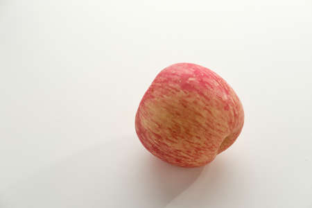 Apel Fuji or Fuji Apple, healthy fruit contain fiber and vitamin C, isolated on white background. Copy space.の写真素材