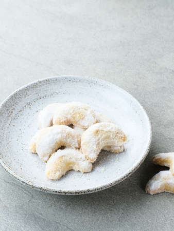Kue Putri Salju or Snow White Cookies with crescent shaped. Made from flour, sugar and butter coated with powdered sugar. Popular to celebrate Eid al Fitr. Selective focus image.の写真素材