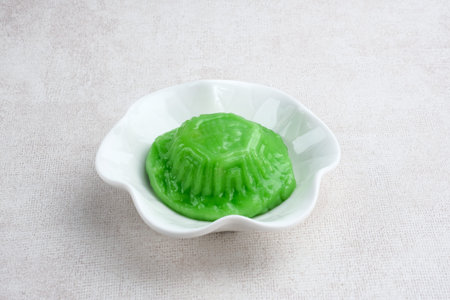 ANG KUE or Kue Ku, steamed Chinese pastry of glutinous rice flour with sweet mung bean paste filling. Sticky, chewy texture. Selective focus image, blurrred background.の写真素材