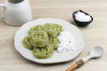 Kue Lumpang Pandan or Kue IJo, Indonesian traditional food with springy texture, made from sago flour and rice flour, sugar and pandan. Served in white plate, selective focus image.の写真素材