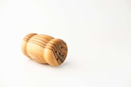 Wooden traditional salt and pepper shakers on white background, selective focus, copy space.の写真素材