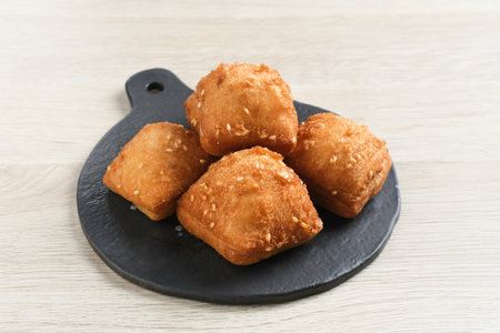 Bolang baling, Odading, fried bread in cubes or blocks, with a light brown crunchy outer skin and...
