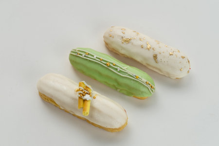 Sweet and colorful eclair with chocolate glaze.