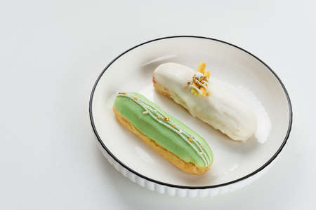 Sweet and colorful eclair with chocolate glaze.の写真素材