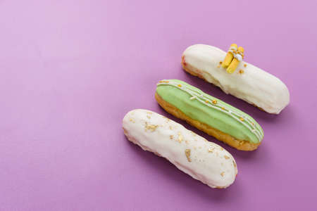 Sweet and colorful eclair with chocolate glaze.の写真素材