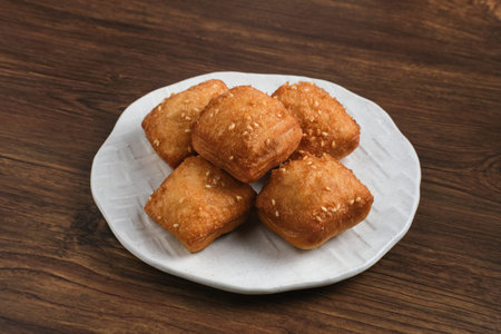 Bolang baling, Odading, fried bread in cubes or blocks, with a light brown crunchy outer skin and...