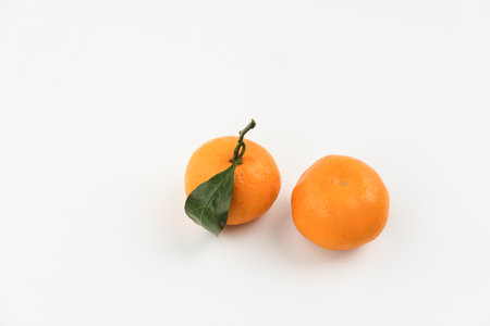 Jeruk Santang Madu (Citrus sinensis) on white background. Free space for text. Often consumed during Chinese New Year.の写真素材