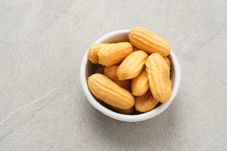 Kue Soes Kering, delicious cheese soes cookies also known as cheesy choux cookies. Served on small...