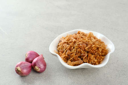 Indonesian crispy deep fried shallots or onion flakes (bawang goreng. Copy space, selected focus image.の写真素材