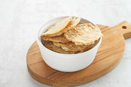 Keripik Tempe or Tempe chips, a typical Indonesian food made from thinly sliced ââtempeh and then fried using seasoned flour. It's salty and savory.の写真素材