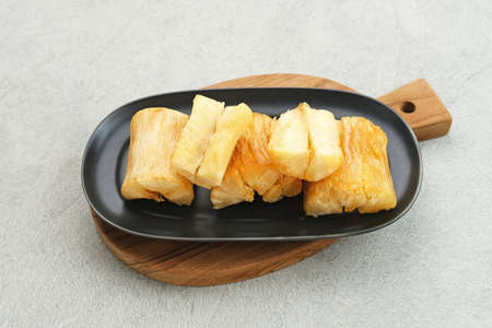 Singkong goreng (fried cassava) is Indonesian traditional snack. Selected focus.の写真素材