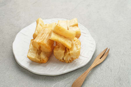 Singkong goreng (fried cassava) is Indonesian traditional snack. Selected focus.の写真素材