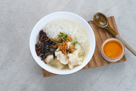 Tekwan, traditional food from Palembang, Indonesia. Made from a mixture of fish meat and tapioca, which is shaped into small balls, with vermicelli, mushrooms, spring onions, celery. Selected focus.の写真素材