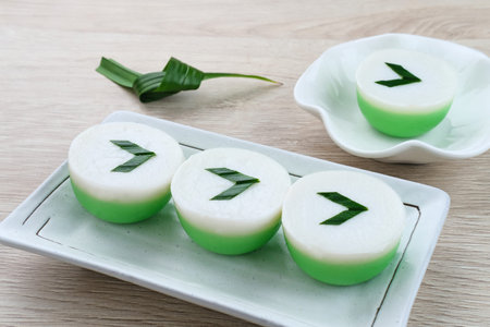 Kue Nona Manis, traditional Indonesian cake made from wheat flour, rice flour, sugar, salt, coconut milk, and pandan leaves, then steamed. Selected focus.の写真素材