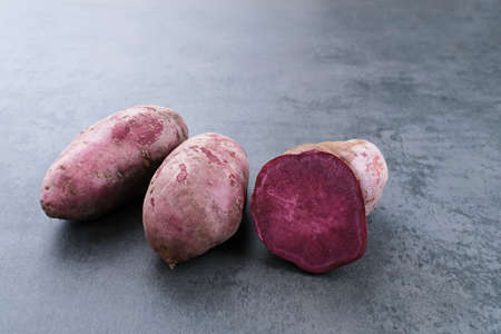 Purple Sweet Potato on dark background. Copy space.の写真素材