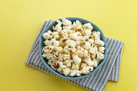 Popcorn, a kind of savory snack from corn seed, selected focus.の写真素材
