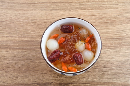 Chinese cuisine, a bowl of peach gum. Peach Gum is Chinese traditional drink that contains peach...
