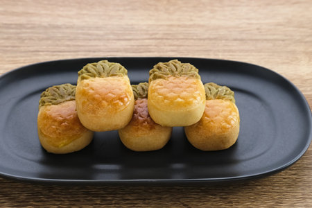 Nastar Cookies, Taiwanese Pineapple Cookies with pineapple-shaped filled with jam. Served in plate...