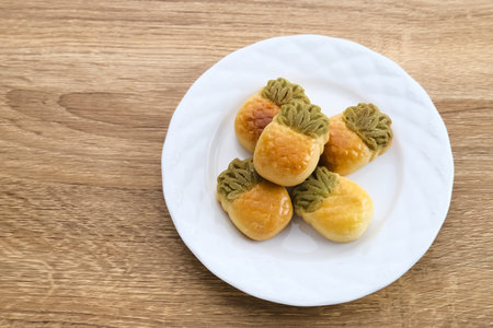 Nastar Cookies, Taiwanese Pineapple Cookies with pineapple-shaped filled with jam. Served in plate...
