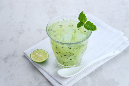 Es Timun Serut, a typical Indonesian drink made from shaved cucumber with syrup, lime and basil seeds. Popular during ramadan.の写真素材
