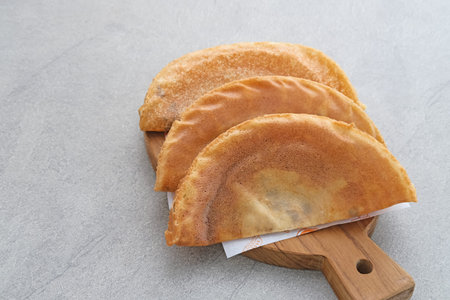 Kue Lekker. Dutch-Indonesian street food, crispy crepes with chocolate filling.の写真素材