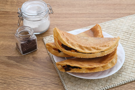 Kue Lekker. Dutch-Indonesian street food, crispy crepes with chocolate filling.の写真素材