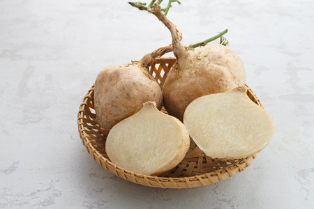 Fresh Jicama or bengkoang, white tubers that can be eaten as salad or for face masks. Served in...