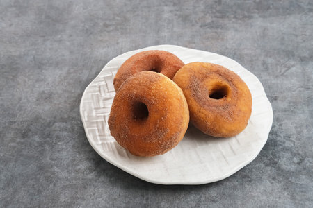 Donat Kentang (Potatoes Donut), donuts with added potato ingredients. Dusted with powdered chocolate...