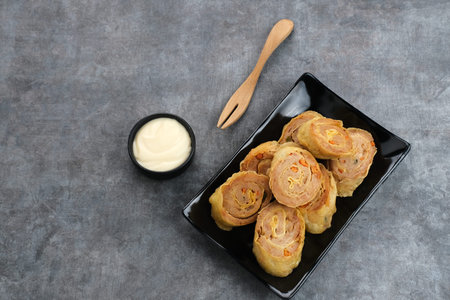 Chicken Egg rolls, made from mixtured minced chicken with tapioca, carrots, scallions and eggs then rolled, steamed and friedの写真素材