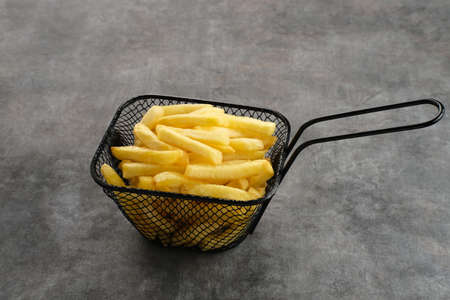 French Fries, tasty and savory fast food served with chili sauce. Space for text.の写真素材