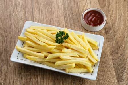 French Fries, tasty and savory fast food served with chili sauce. Space for text.