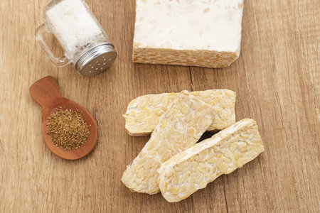 Raw Tempeh, Tempeh or Tempe, Indonesian traditional food, made from fermented soybeans. Usually fried for a side dish or for other cooking ingredients.の写真素材