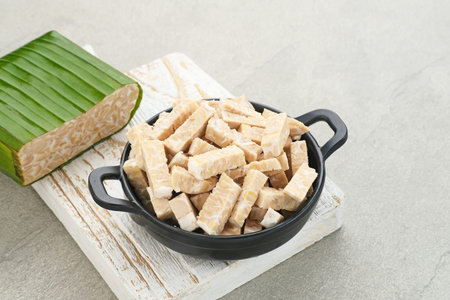 Raw Tempeh, Tempeh or Tempe, Indonesian traditional food, made from fermented soybeans. Usually...