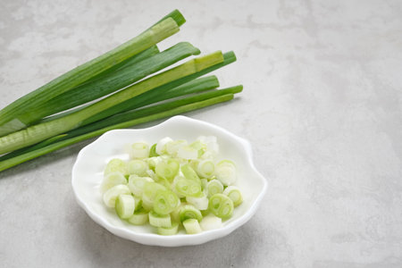 Whole and cut fresh leeks, food ingredientの写真素材