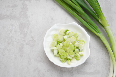 Whole and cut fresh leeks, food ingredientの写真素材