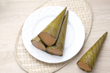 Clorot, Indonesian traditional cake made from rice flour with coconut milk, wrapped in young coconut...