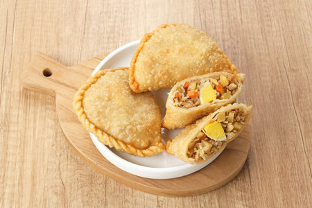 Jalangkote, Indonesian traditional snack filled with egg, carrot, potato, rice noodles. Served with...