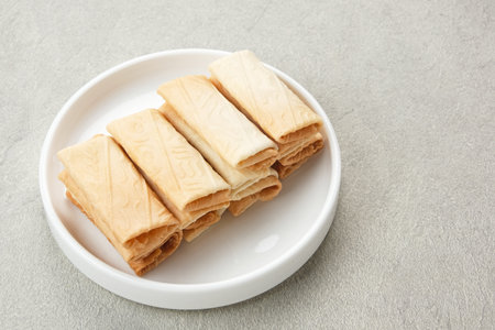 Kue Lempit or Kue Kapit, Indonesian traditional snack, crunchy and sweetの写真素材