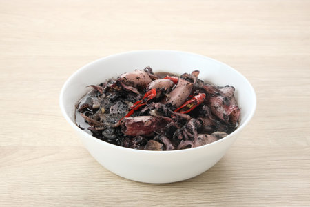 Squid Black Soup (Tumis Cumi Hitam) or stir-fried squid in black ink, Indonesian traditional foodの写真素材