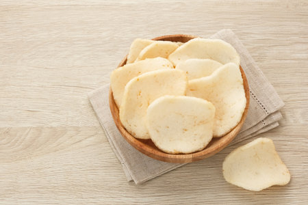 Kerupuk Udang, Crispy Prawn Crackers in wooden plate.の写真素材